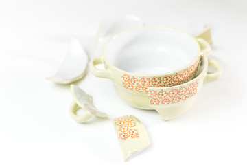 Broken and whole plate on a light background.
