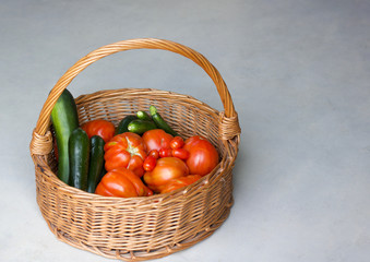 natural tomatoes and zucchini in a basket