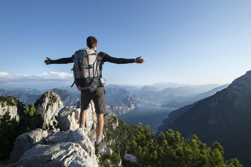 Hiker happy on the summit of the mountain
