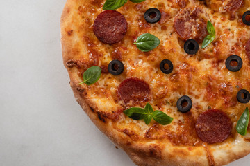 Pepperoni pizza on a white background. Copy space.