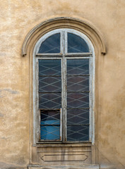 Windows on the facade of houses in the old city