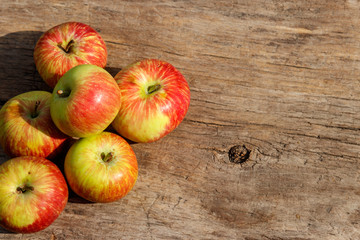 Fresh ripe apples on wooden table. Top view, copy space