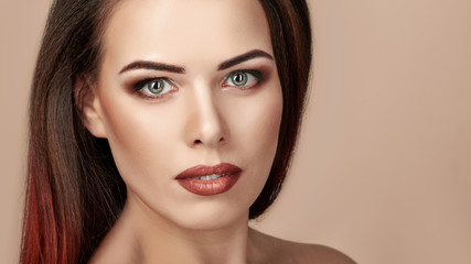 Portrait of gorgeous young brunette woman with bright makeup