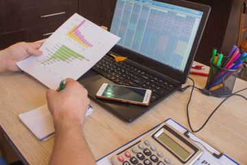 Close up view of bookkeeper or financial inspector hands making report, calculating or checking...