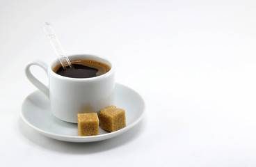 Black coffee in a white porcelain Cup with sugar.