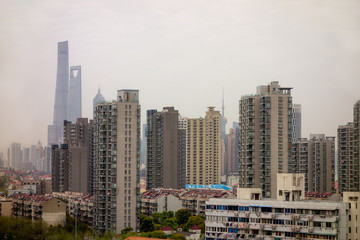 Fototapeta na wymiar Cityscape of Shanghai, China with a lot of houses covered in a smog