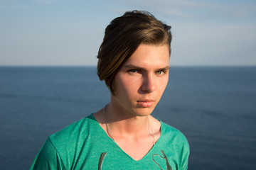 A young guy is resting on the sea.