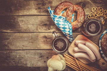 Oktoberfest concept - traditional food and beer on rustic background - obrazy, fototapety, plakaty