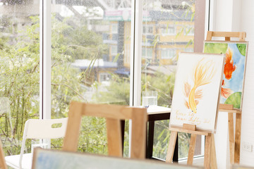 Art room in relax time and raining drop near window. Fish painting in iving room.