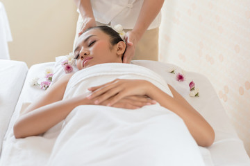 Young girl in spa massage