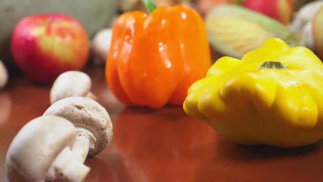Autumnal Harvest or Thanksgiving, Cornucopia filled with vegetables, vegetables spilled out of the basket on the table. 4k, dolly shot