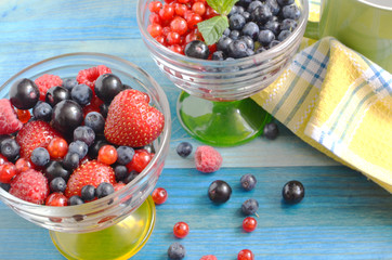 berries of red-blue color on a blue background healthy food	