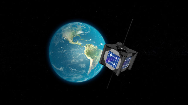 Cubsat et terre en fond