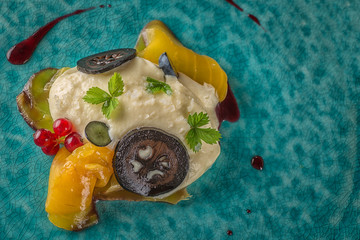 exclusive cheese mousse with marinated walnuts and golden beetroot served on turquoise plate, top gastronomy 