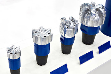 Drill bits for oil wells