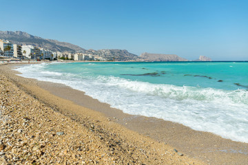 European beach with clear and turquoise blue waters in the beautiful Mediterranean ocean
