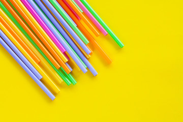 Colorful Straw on color background.