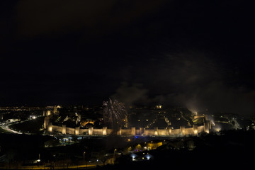 Fototapeta na wymiar night views of fireworks in the city of Avila in Spain, medieval walled city perfectly preserved 