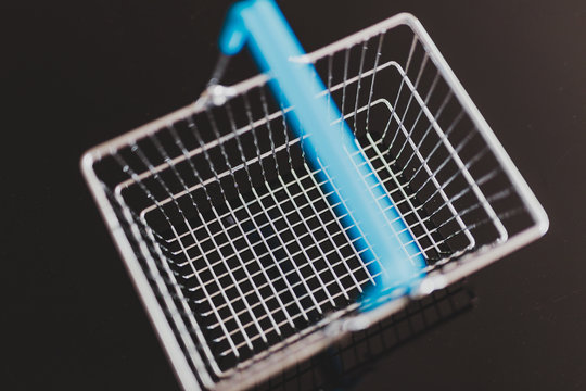 Empty Silver Shopping Basket On Black Seen From Above