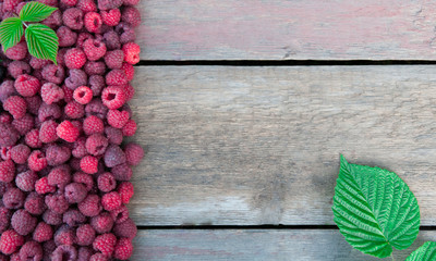 Obraz na płótnie Canvas Raspberries on a wooden background
