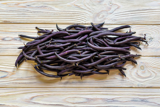 heap of france violet beans in retail vegetable super market for sale