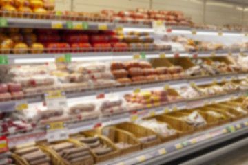 Blurred photos showcases shops. Long rows of racks with goods.