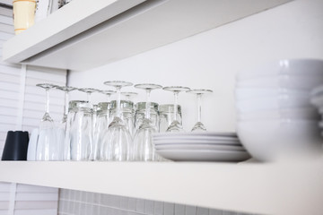 Kitchen glassware on white shelf, Interior design details