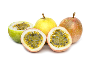 two passion fruit and haft cut three on white background,seed focus