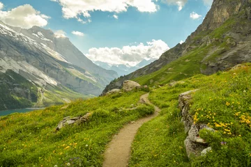 Foto op Canvas Winding walking trail high above the Oeschinensee lake © Michal