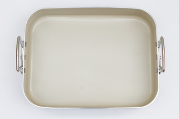 Empty metal baking dish isolated on white background