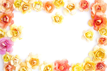 frame of colorful paper yellow, orange flowers, roses on white background