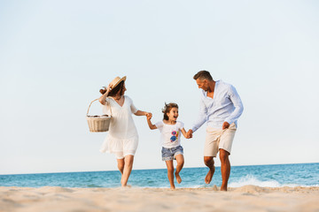 Happy family having fun together at the beach.