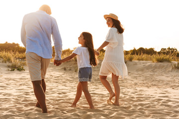 Happy family having fun together at the beach.