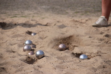 Jeu de boules game on a floor of sand on the town hall square in Nieuwerkerk aan den IJssel in the Netherlands