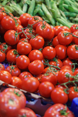 Fresh tomatoes on the counter of a street market or a supermarket or a store. 