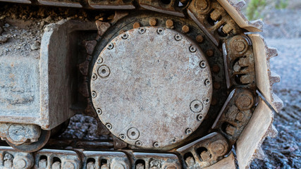 Continuous tracks on a backhoe loader.