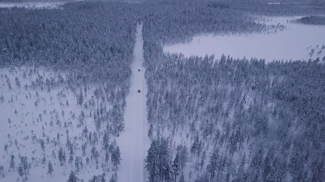 An shot of two cars traveling through the swedish winter. Shot was taken in januari in Salen, Sweden.