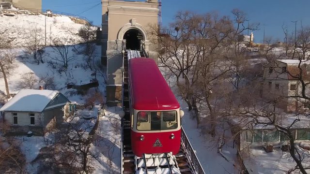 Aerial Close around Vladivostok Unique funicular caravan only dandy. Electric tram rails bridge Eagle Sopka Hill. City public transport. Travel tourist attraction. Russia Asia. Winter snow sunny Drone