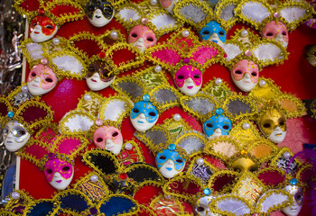 Fototapeta na wymiar Venetian carnival masks at show case in Venice, Italy