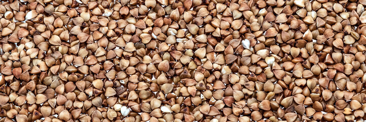 Background of buckwheat groats on the entire field of the image.