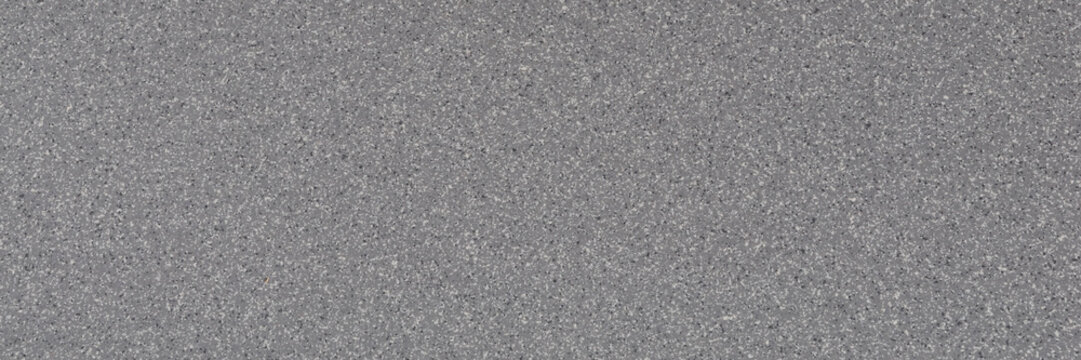 Background of gray granite with a texture of black and white spots.