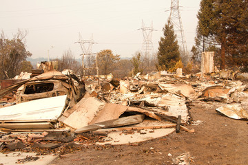 home burned to the ground, garage door buckled and laying in a heap after the recent wild fire fire...