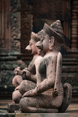 Fototapeta na wymiar Stone carvings at the UNESCO World Heritage Site in Cambodia of the temple at Banteay Srei