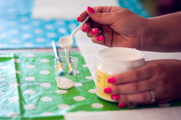 Children hands making artworks with wood and paint crafts. workplace and handcraft