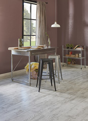 Decorative brown wall background window garden view and metal table dining room style with chair.