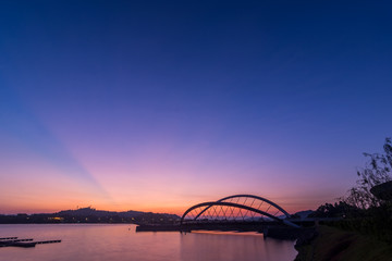 Fototapeta na wymiar Putrajaya Bridge Sunrise at lakeside