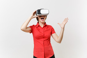 Portrait of young smart business woman in red shirt, black skirt in headset of virtual reality on head isolated on white background. Education or teaching of future in high school university concept.