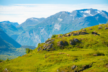 Wooden old houses in mountainous region is on the rise to the mountain Dalsnibba in Norway