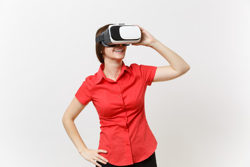 Portrait of young smart business woman in red shirt, black skirt in headset of virtual reality on head isolated on white background. Education or teaching of future in high school university concept.