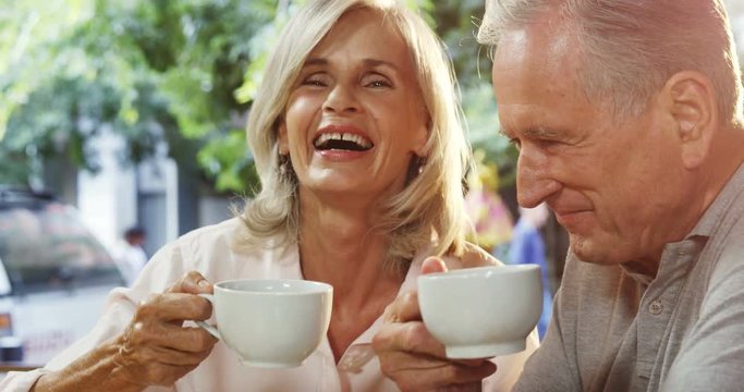 Senior couple having coffee in cafe 4k